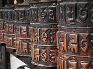 Decorated brass buddhist prayer wheels in Nepal by iPics Photography