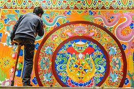 Single-legged painter at the Thubchen Choekhorling Monastery in Litang by Theo Molenaar