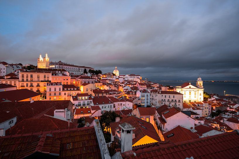 Lisbon by night with its beautiful cityscape and historic buildings by Leo Schindzielorz