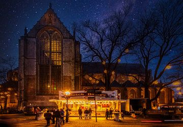 Queuing for the oliebollenkraam at the Grote Kerk in alkmaar by peterheinspictures