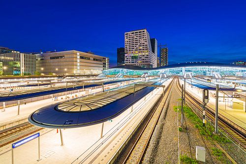 Utrecht central railway station at dusk. Modern contemporary architecture and the biggest and most i