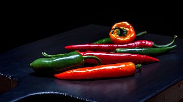Peppers on a wooden cutting board