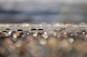 Watery beach sand by Yvonne van der Meij