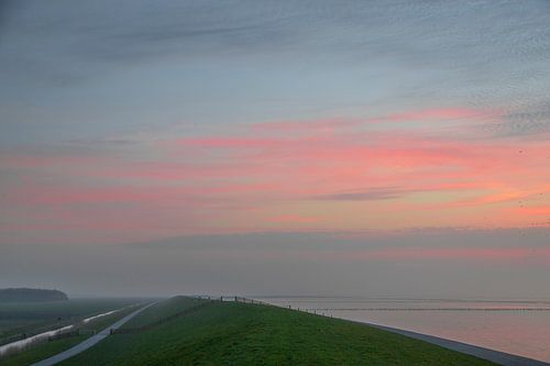 Zonsondergang bij waddenzee