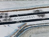 Text It giet aon written in the snow. Famous text of the icemaster when the Elfstedentocht took plac