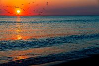 Zonsondergang aan zee