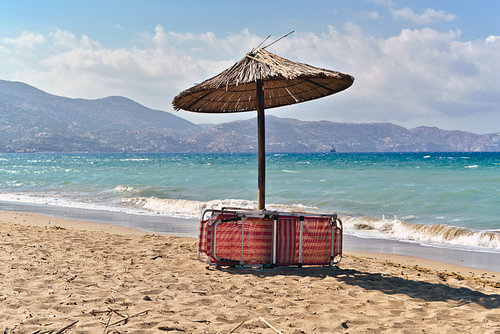 Summer poetry with an umbrella on the island of Crete 