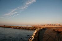 Het havenhoofd van Scheveningen bij zonsondergang