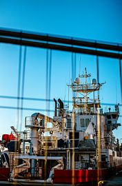 Shipyard View Through Fence – Blue Sky & Industrial Detail | Maritime Wall Art