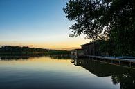 Landscape on a lake with boat house by Rico Ködder thumbnail