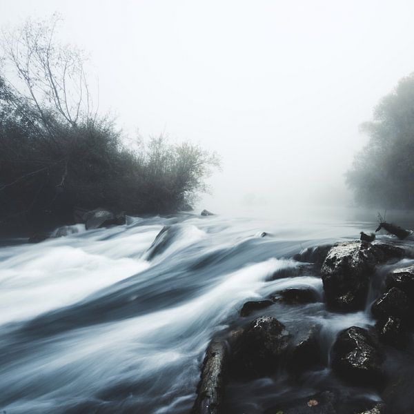 Cascade waterfall on foggy mystical morning by Patrik Lovrin