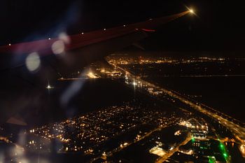 Touching down in Amsterdam under the night sky