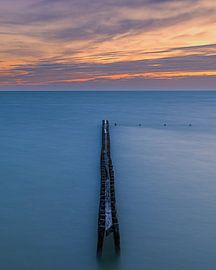 Sunset at a breakwater near Hindeloopen by Henk Meijer Photography