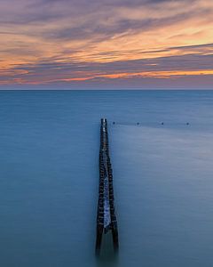 Sonnenuntergang an einem Wellenbrecher bei Hindeloopen