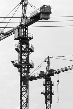 Play of lines cranes on construction site