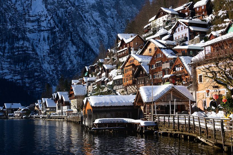 Traditional wooden Hallstatt lakeside houses in the snow in winter by iPics Photography