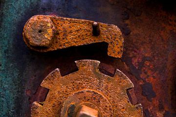 Rusted brown iron gear with emergency stop lever by Paul Wendels
