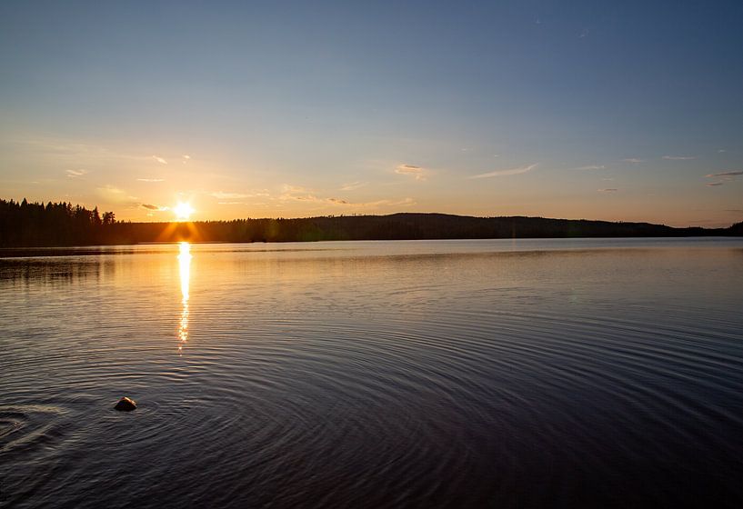 Sunset on Swedish lake by Kim Hoozemans