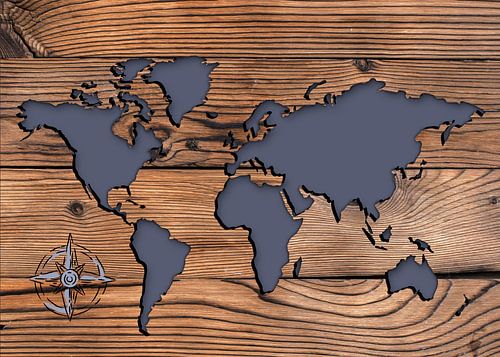 World Map on Wooden Background with Compass Rose