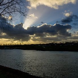 Beams of light from the sun by Devlin Jacobs