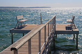 Benches overlooking the sea by Inge Hogenbijl