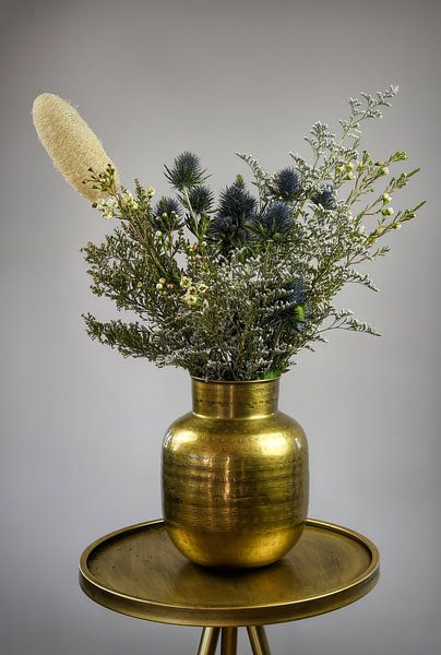 Pretty bouquet in gold vase by Marjolein van Middelkoop