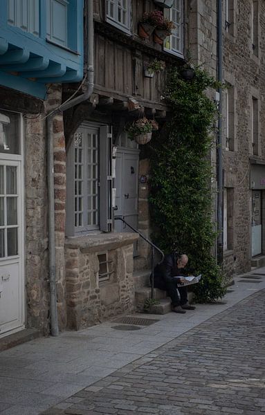 reading the newspaper by Sebastian Stef