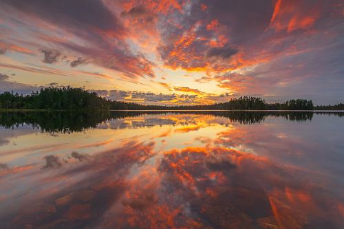 Spectacular red sunset over a lake in Orsa, Sweden