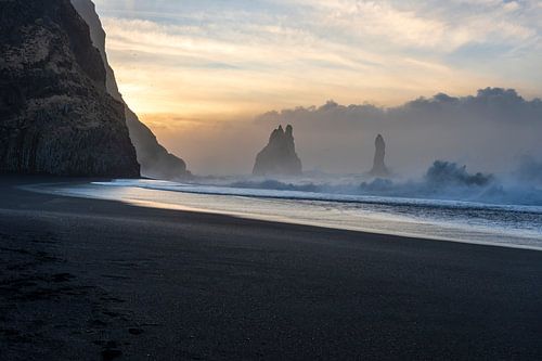 Sunrise at the wild sea and black sand beach of Reynisdrangar Iceland