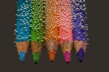 Colored pencils with water bubbles