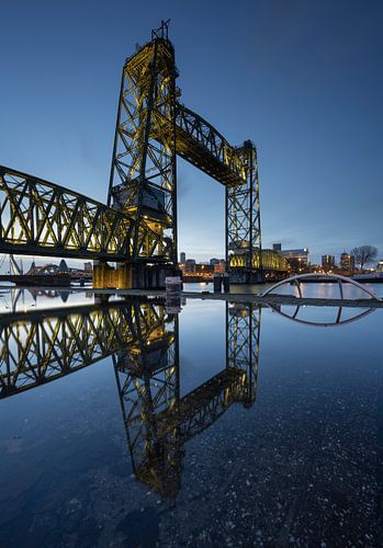 Reflection of De Hef bridge in Rotterdam during the blue hour by Raoul Baart