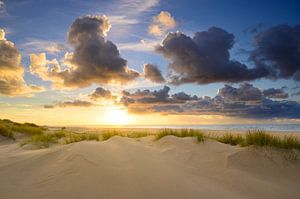 Sunset at the beach of Texel with sand dunes in the foreground