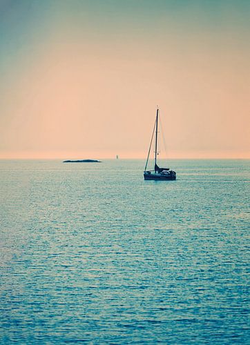 lonely sailboat on the sea.