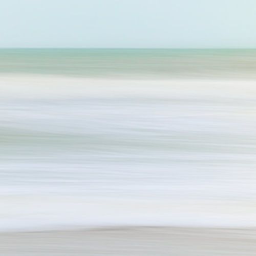 Softness. Shooting with a slow shutter speed creates a painterly softness in this photograph of the North Sea in the soft, winter morning light
