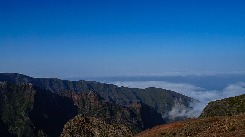 Madeira - Mountain Pico do Arieiro with red rocks and clouds beneath panorama landscape view with blue sky by adventure-photos