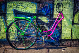 Neon on Asphalt – A Bicycle Fragment Against Graffiti by The Hazel Perspective