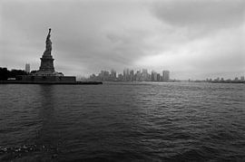 Lady Liberty is guarding the city by Willem Holle WHOriginal Fotografie