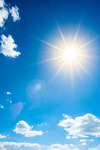 Bright sun on blue sky by Günter Albers