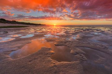 Sunset on beach at low tide by Rob Kints