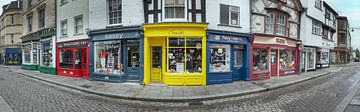 Panorama of colourful shops in street of Alchester, England. by Albert Brunsting