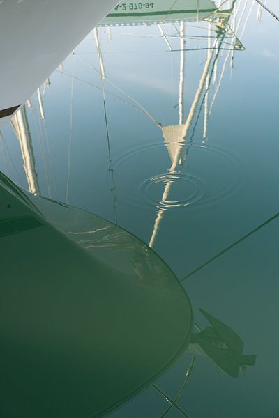Reflection of sailboats in blue green sea water 2 by Adriana Mueller