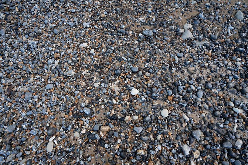 Pebbles on the beach by Mickéle Godderis
