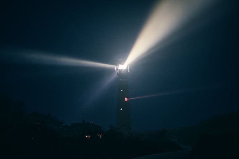 Schiermonnikoog lighthouse in the dunes during a foggy night by Sjoerd van der Wal Photography