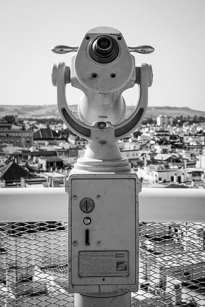 Binoculars with a view over Seville by Evelien Oerlemans