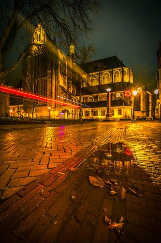 Cyclist passes the big kek in alkmaar by peterheinspictures