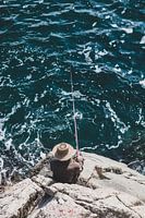 A fisherman on the rocks on the east coast of North Korea