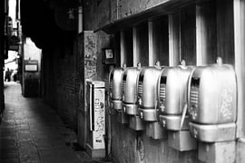 Nostalgic pay phones in a narrow alleyway – Venice by Yahya Algehaili