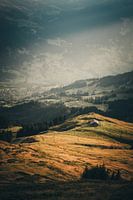 Mountain hut in a warm autumn landscape