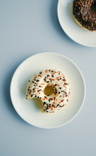 Bitten Doughnut on Pale Blue