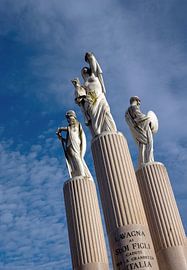 Three statues in Lavagna Italy on columns. by Albert Brunsting